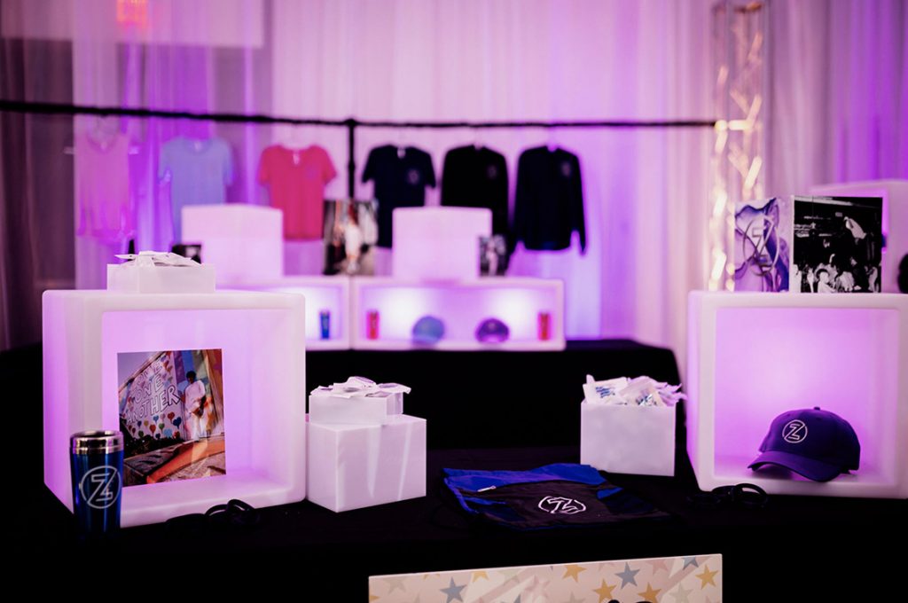 Contemporary lounge furniture rental for a Destination Management Company corporate event in Miami with modern white seating and cocktail tables.